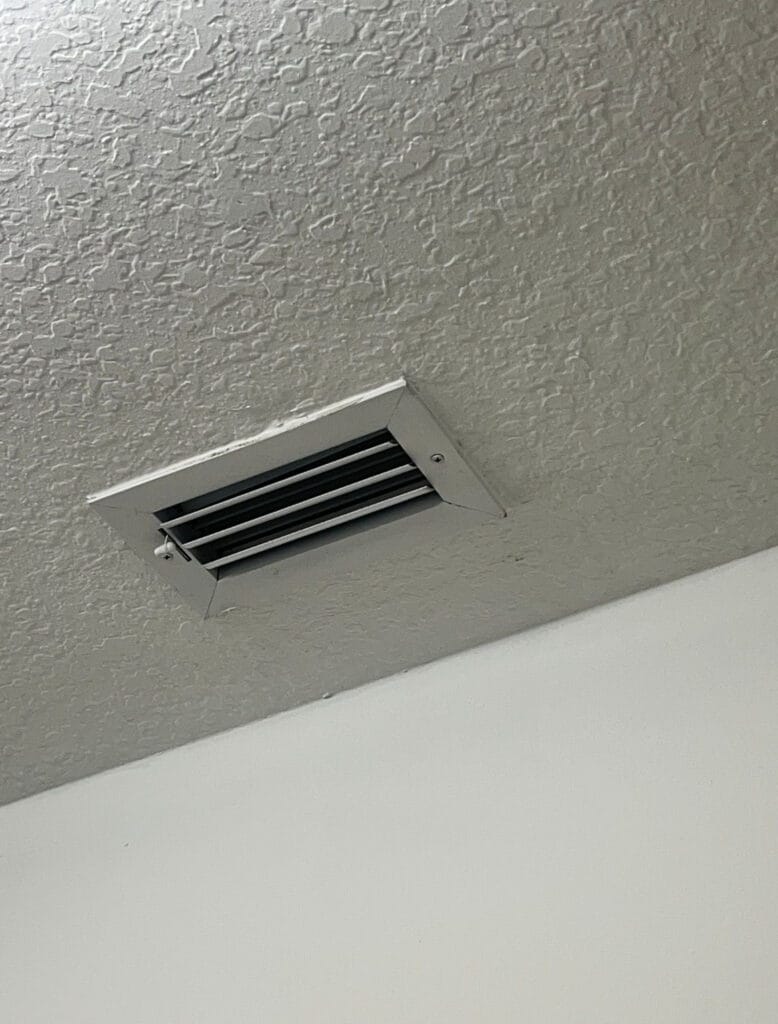 Ceiling air supply vent and surrounding ceiling